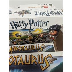 Collection of Lego Games sets, including no. 3841 Minotaurus, 3862 Harry Potter Hogwarts, 50011 Lord of the Rings Battle of Helms Deep, 3860 Heroica Fortaan, 3848 Pirate Plank, 3855 Ramses Return, 3844 Creationary, etc