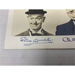 Stan Laurel and Oliver Hardy signatures on head and shoulder portrait of the two comedians inscribed 'THANK YOU D. WILLIS' 9 x 12.5cm