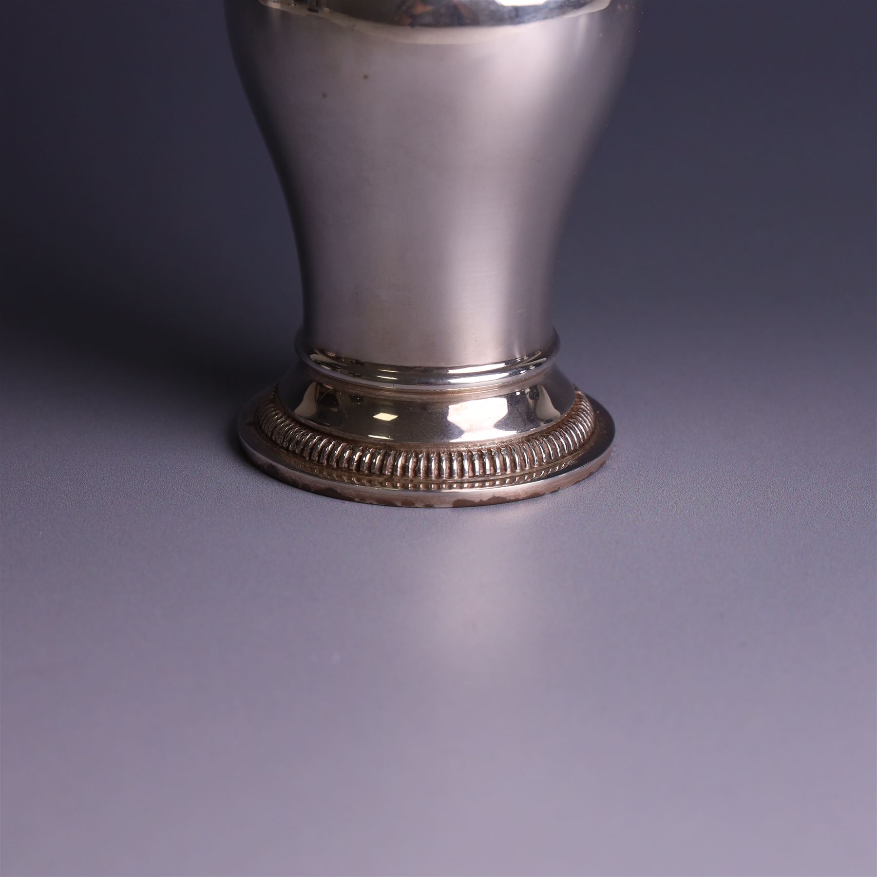 Mid 20th century silver sugar shaker, of typical baluster form, the removable pierced cover with urn finial, hallmarked William Comyns & Sons Ltd, London 1961