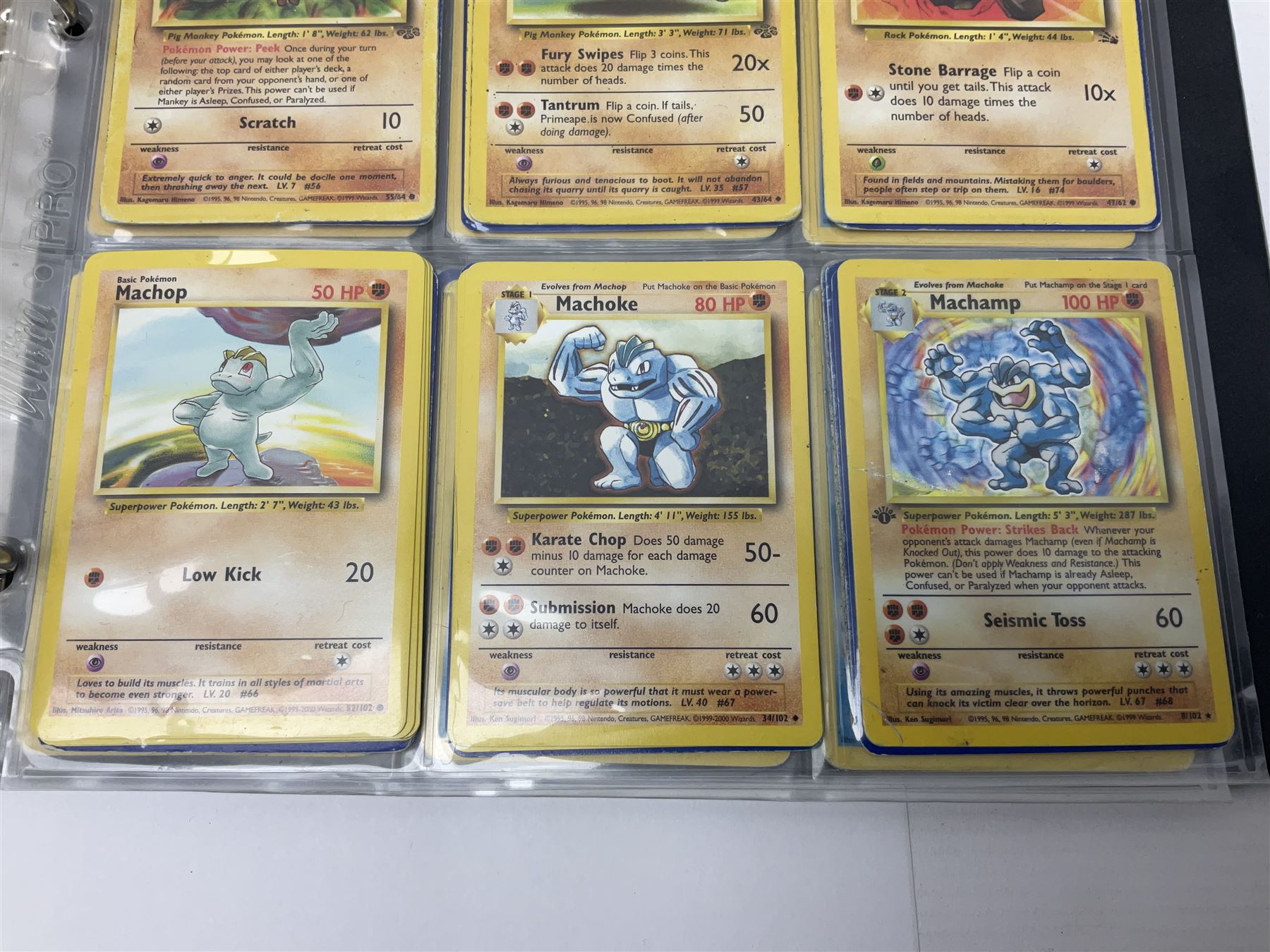 Collection of Pokemon trading cards, mostly 1999 Wizards Pokemon cards to include holo Charizard 4/102, first edition holo Machamp 8/102, further holographic cards; Dark Flareon 35/82 and Dark Vaporeon 45/82, cards from themed sets and 4th edition prints; 1998 Electronic Pokédex with cardboard boxes for themed decks Blackout, Overgrowth and Power Reserve Jungle, along with a large quantity of energy and trainer cards 