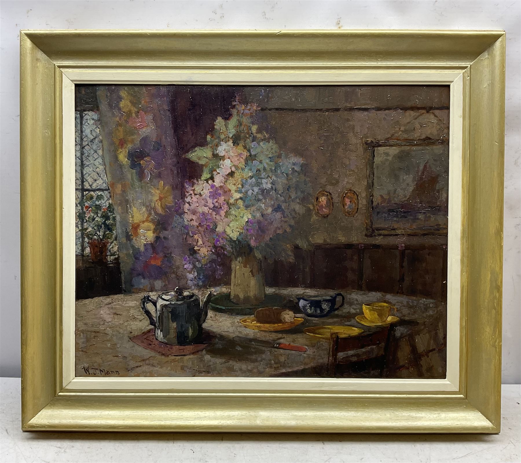 William J Mann (Scarborough early 20th century): The Breakfast Table, oil on board signed 47cm x 59cm 
Notes: Mann was a member of the Fylingdales Group of Artists and lived in Newby, Scarborough.