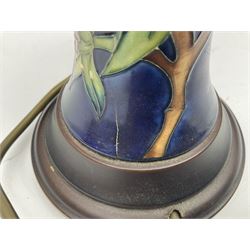 Moorcroft Simeon pattern table lamp base of slim baluster upon a turned wooden base, H42cm