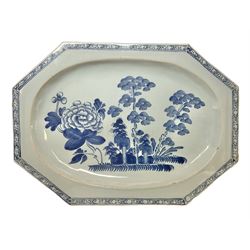 Late 18th century Delftware dish of elongated octagonal form, painted in blue with a large chrysanthemum bloom and trees within diaper border, W33cm L24cm
