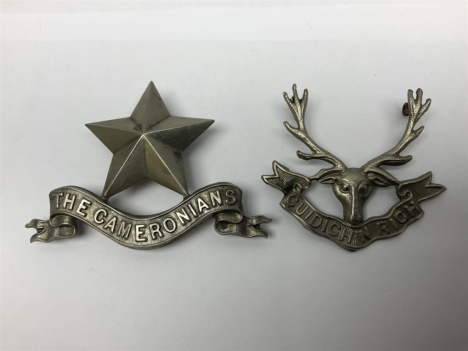 Thirteen Scottish metal Glengarry badges including Black Watch, Highland Regiment, Cameronians, Argyll & Sutherland, Seaforth Highlanders, Kings Scottish Own Borderers etc