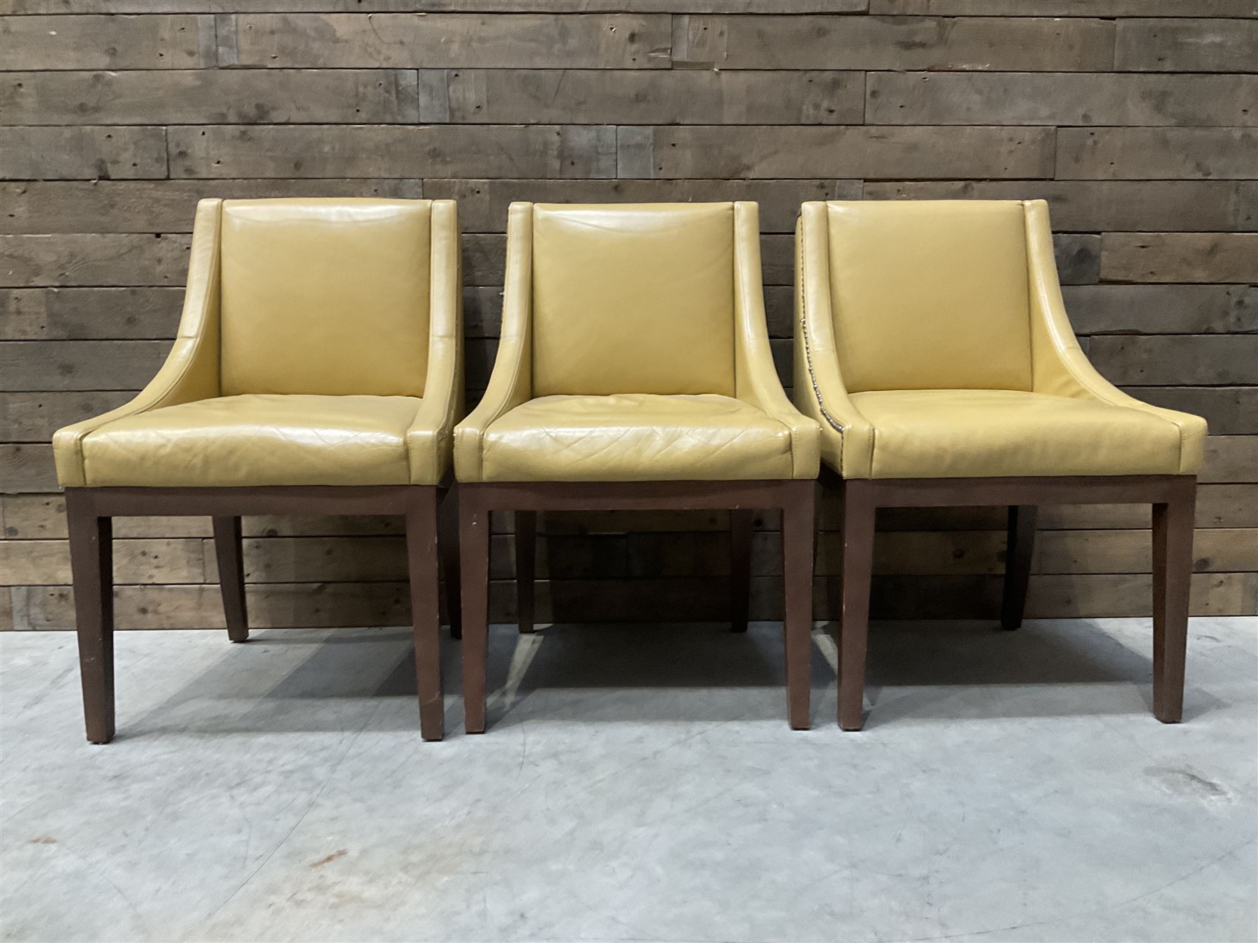 3 x walnut framed dining chairs, upholstered in a dark beige leather