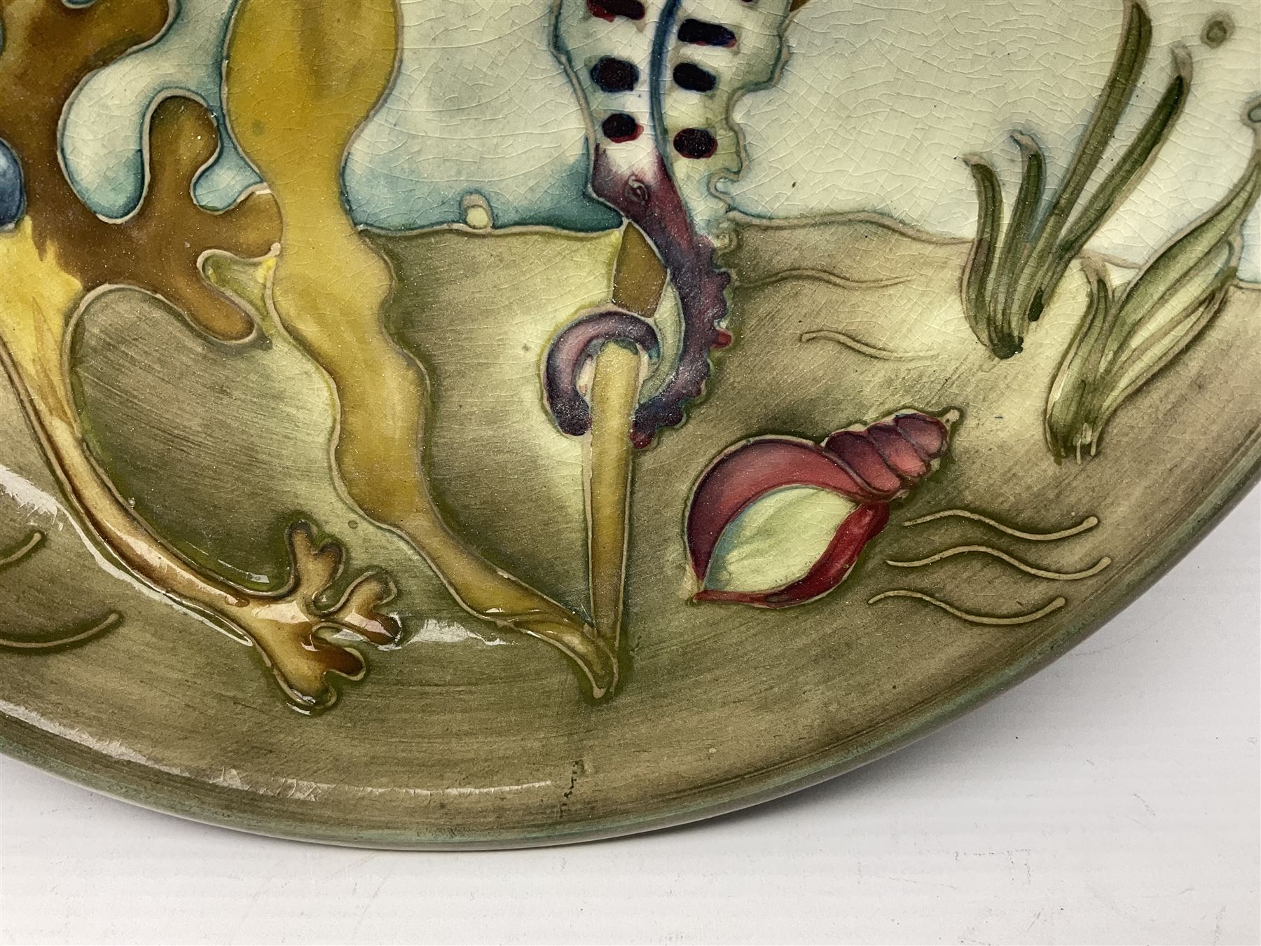 Moorcroft charger decorated in Seahorse pattern, circa 1960, with painted and impressed marks beneath, D26cm