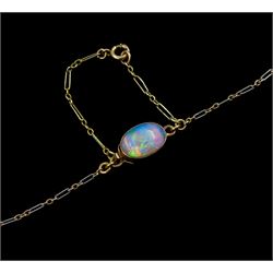 Edwardian gold opal and ruby pendant necklace, the central milgrain set cluster, suspending to two further opal and ruby drops, on platinum and gold trace link chain, with opal clasp