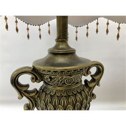 Pair bronzed amphora lamps with pineapple decoration, scroll handles and foliate base with scrolled feet together with pair peach ground shades and raised floral pattern H76cm (2)