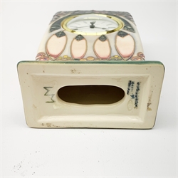 A Moorcroft mantle clock, decorated in the Cluny pattern designed by Sally Tuffin, with impressed and painted marks beneath, H15.5cm.