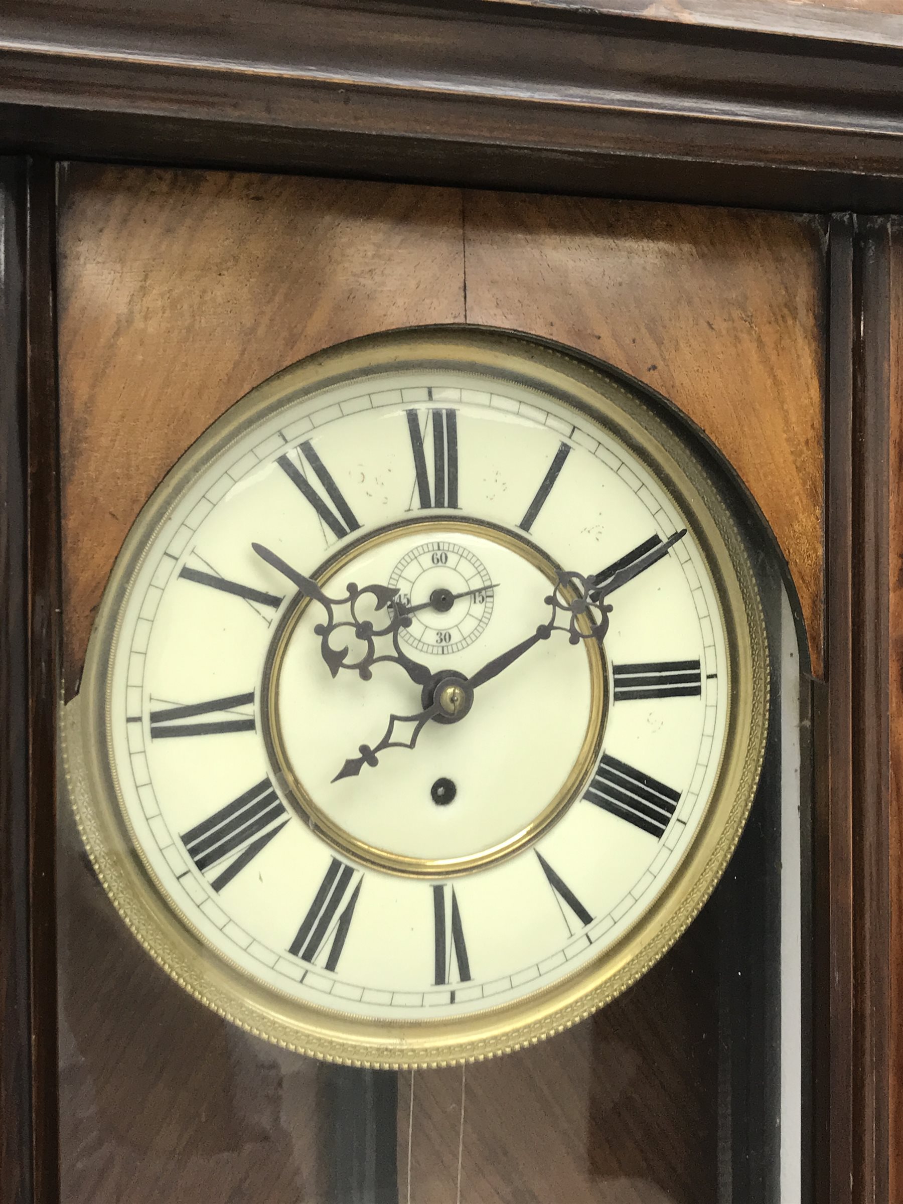 Late 19th century Vienna type wall clock in walnut case,  figural pediment above glazed door with half turned pilasters, single weight driven movement stamped '159964', H132cm