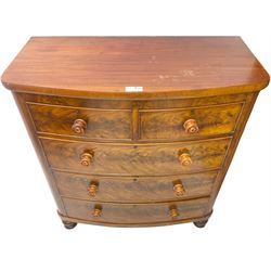 Victorian mahogany bow-front chest, fitted with two short and three long cock-beaded drawers with turned handles, on turned feet
