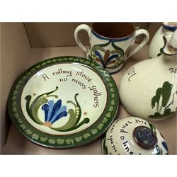 Collection of Torquay and similar Motto ware, including jugs, candlesticks, twin handled mug etc 