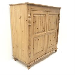 Solid pine cupboard/wardrobe, two doors enclosing single hanging rail, turned supports, W123cm H131cm, D61cm