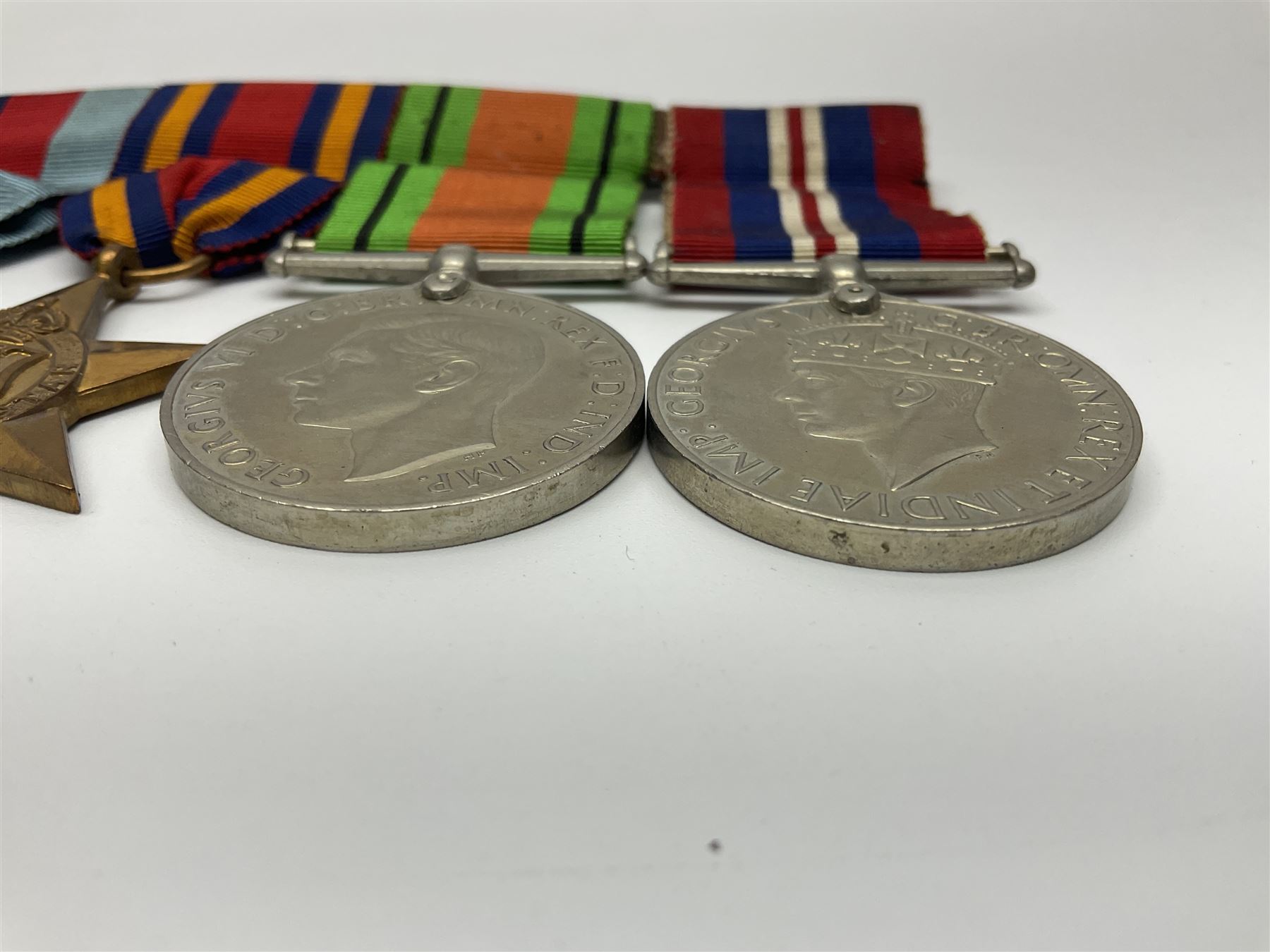 Collection of WW2 and police medals c.1933-1955, awarded to Eric Drinkwater comprising 1939-45 War Medal, Defence Medal, 1939-45 Star and Burma Star, on wearing bar; 1918-62 General Service Medal with Cyprus clasp to P.S. E.G. Drinkwater; boxed; Police Long Service and Good Conduct Medal to Const. Eric C. Drinkwater; cased; Royal Life Saving Society bronze medal to E.C. Drinkwater July 1933; boxed; and George V 1937 coronation medallion; boxed.