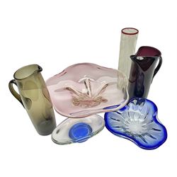 Two Whitefriars glass jugs, together with a Swedish Pukeberg art glass vase and three art glass bowls, including large pink example, some signed to base, tallest H30.5cm