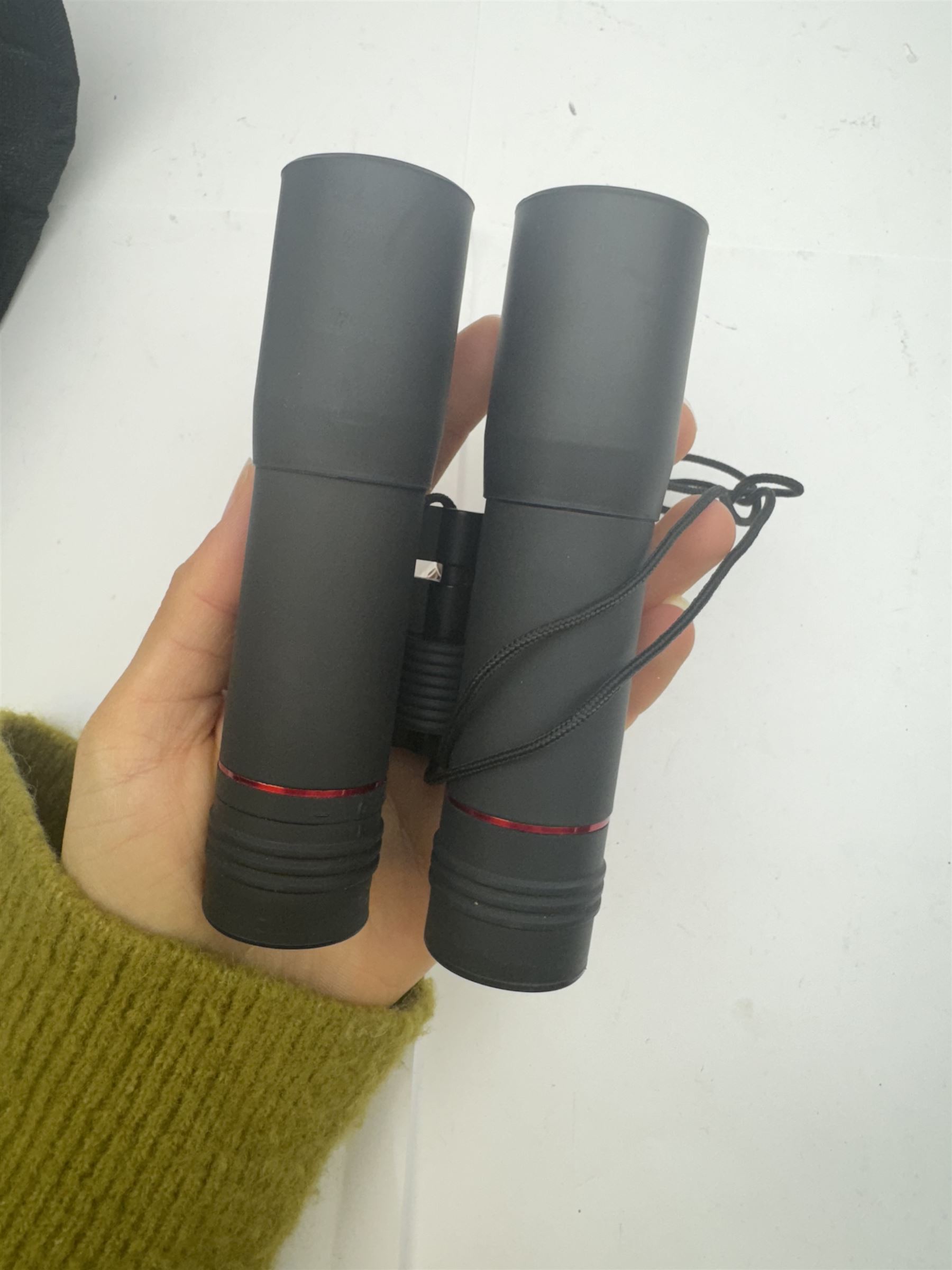 Four pairs of binoculars, to include Carl Zeiss Jena Jenoptem 8x30W serial no. 3750814, Nikon Sporting II 8x40 serial no. 604672, Minolta Pocket II 8x22 Field 7 and Jessops 12x25 Field 4.8 84m/1000m, all in carrying cases 