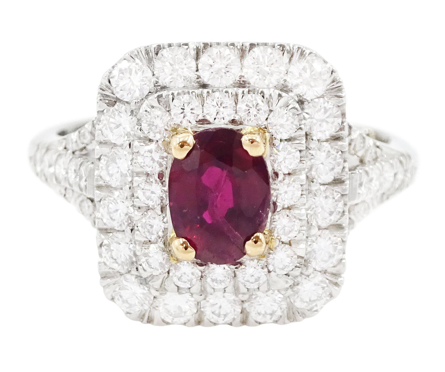 Platinum ruby diamond cluster ring, single oval cut ruby  in a four claw 18ct rose gold setting of approx 1.02 carat, surrounded by two rows of round brilliant cut diamonds and split diamond set shoulders, London 2017, total diamond weight approx 0.76 carat, with Alan Poultney Gems report