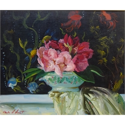  Still Life of Roses in Front of an Aquarium, oil on board signed by Charles Merrill Mount (American 1928 - 1995) 37cm x 45cm  