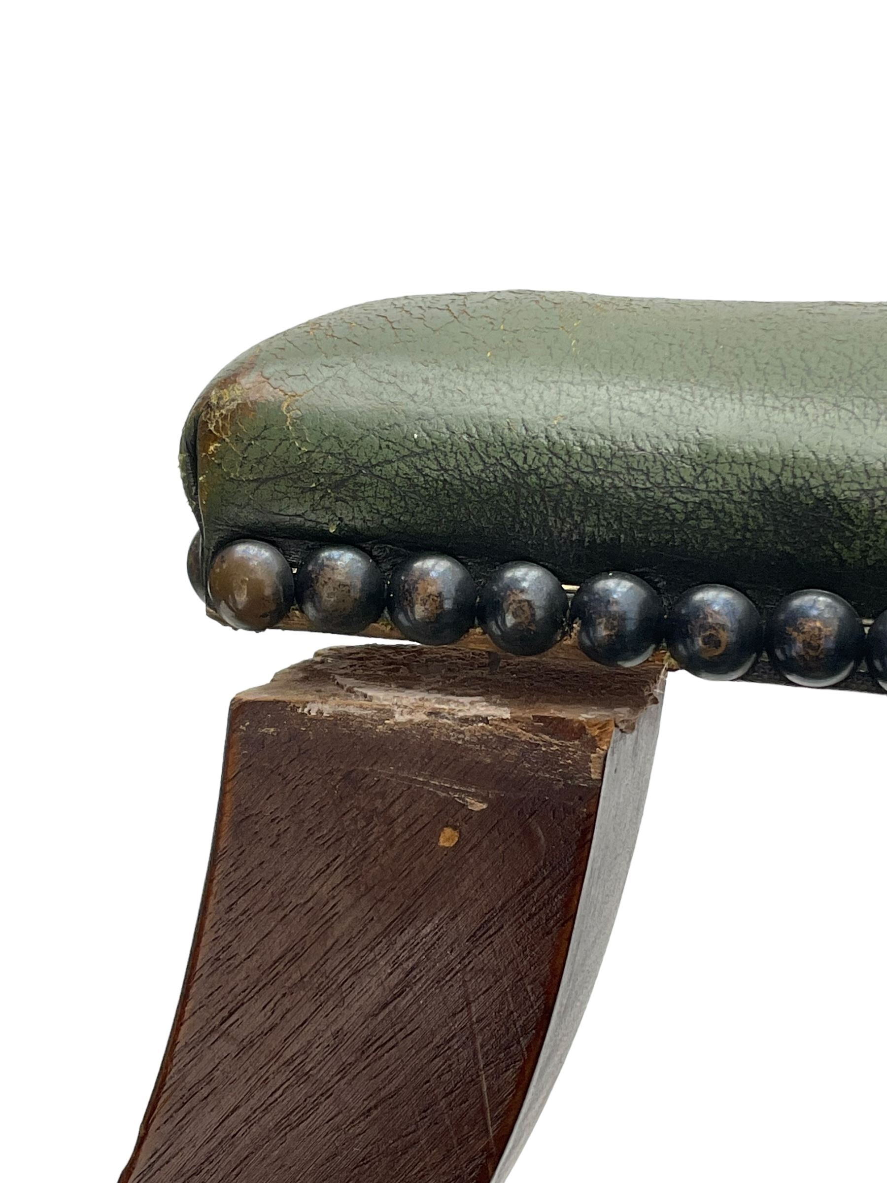 Georgian design swivel office desk chair, upholstered in buttoned green leather, on five spoke base with castors 