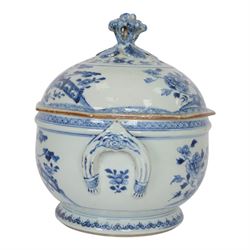 Late 18th/early 19th century Chinese export blue and white tureen and cover, the body with twin curved handles, the pieced and domed cover with multi flower head finial, painted with peonies, rockwork, and fences, overall H26.5cm D22cn 