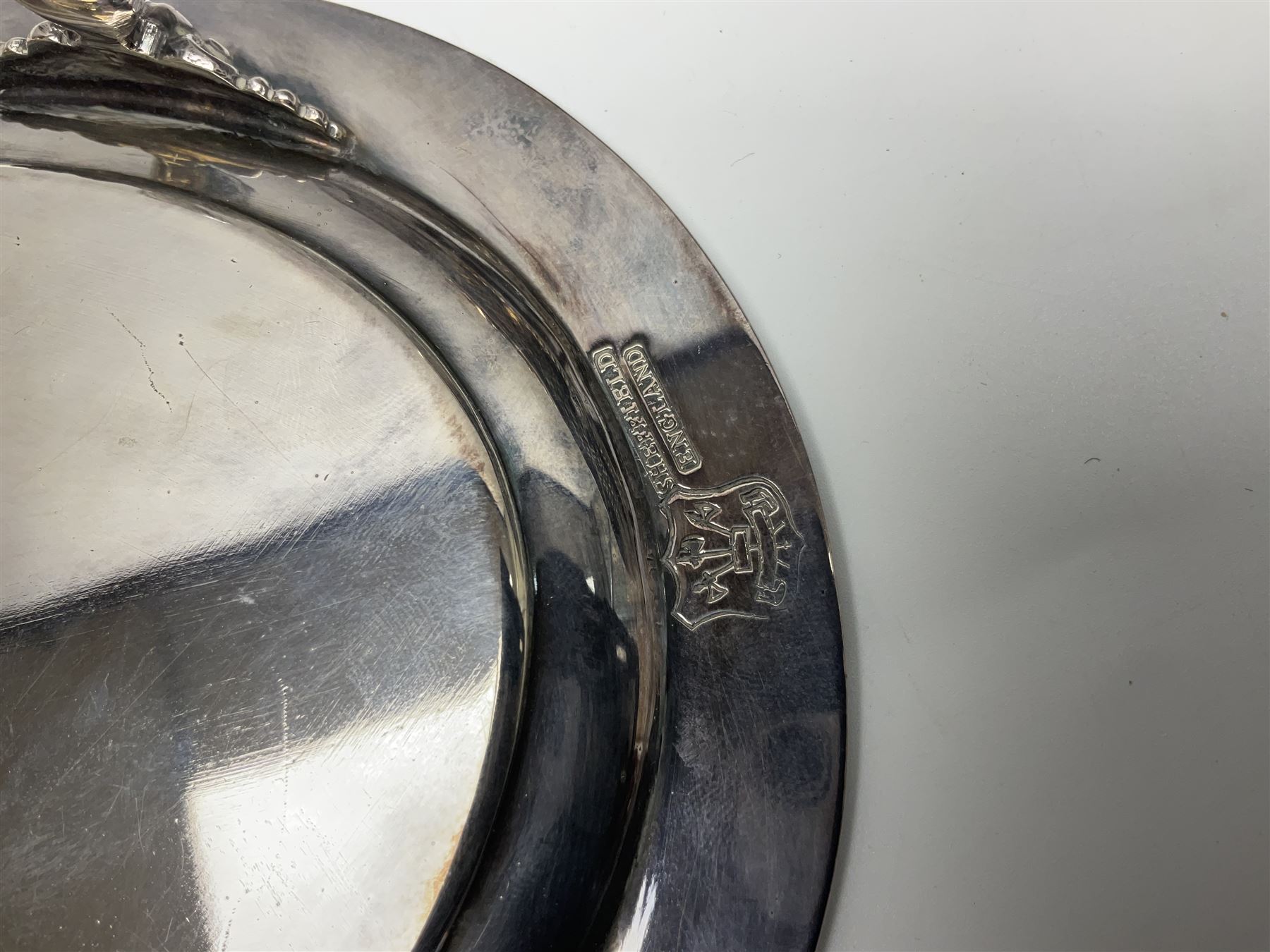 Pair of Mappin and Webb silver plate pierced pedestal bon bon dishes, together with other silver plate comprising teapot stand engraved with lion's head to centre, two cut glass claret jugs, two bottle coasters with acorn decoration, two open salts upon dolphin mounts, tea caddy, three piece cruet set and a large oval tray with pierced sides and upon four ball feet