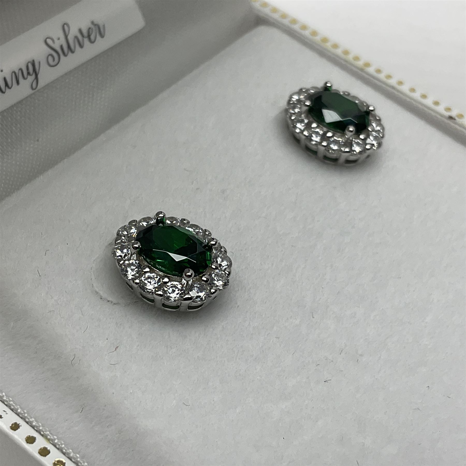Pair of silver green stone and cubic zirconia cluster stud earrings, stamped 925, boxed 
