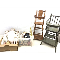  A large quantity of modern and reproduction bisque headed dolls, together with two reproduction metamorphic high chairs, a wicker pram, etc.   