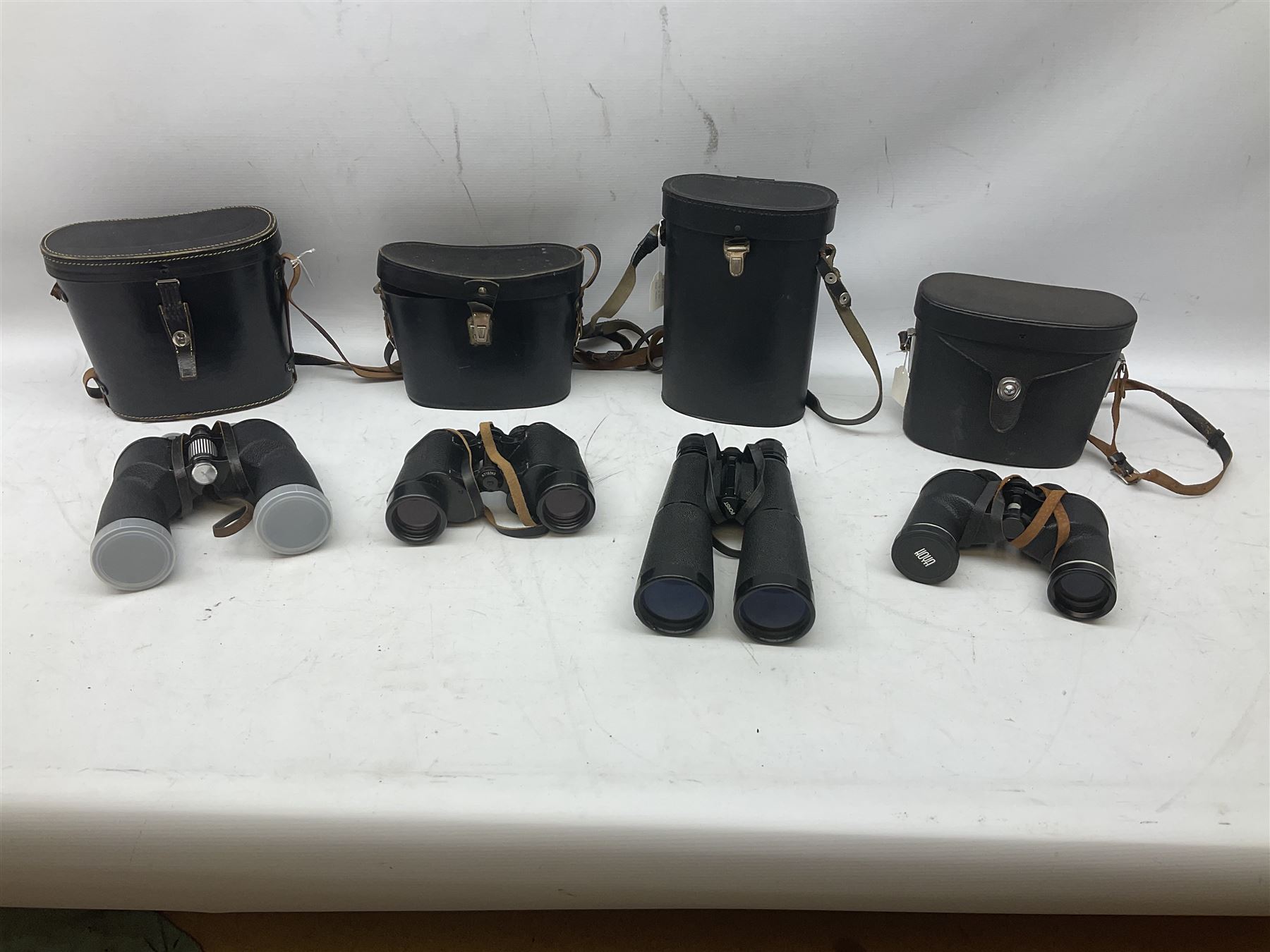 Nine cased pairs of binoculars to include Lieberman & Gortz 12x50, Frank Nipole 8x56, Uniscope, Hoya mark II 8x40, Porst 8x56 etc