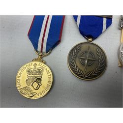 NATO Service Medal with clasp for Former Yugoslavia; together with three copy medals - Iraq Medal with clasp for 19 Mar to 28 Apr 2003 and unfitted rosette; Operational Service Medal with Afghanistan clasp; and QEII Golden Jubilee 2002 medal; all with ribbons (4)