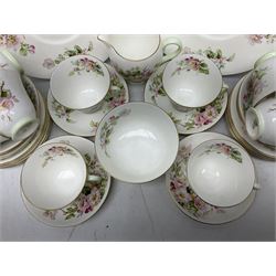 Royal Doulton Apple Blossom pattern tea service for twelve, comprising twelve saucers, twelve tea plates, twelve teacups, milk jug, sucrier and two cake plates