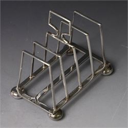 Victorian silver toast rack, with five angular bars and loop handle, upon four squat bun feet, hallmarked Thomas Hayes, Birmingham 1893, height including handle H10cm