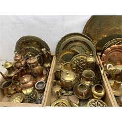 A large collection of assorted brass and copper, to include a large Eastern brass charger, D57.5cm, a number of further Eastern and other brass chargers and plates, quantity of mounted and unmounted horse brasses, teapots, figures, etc. 