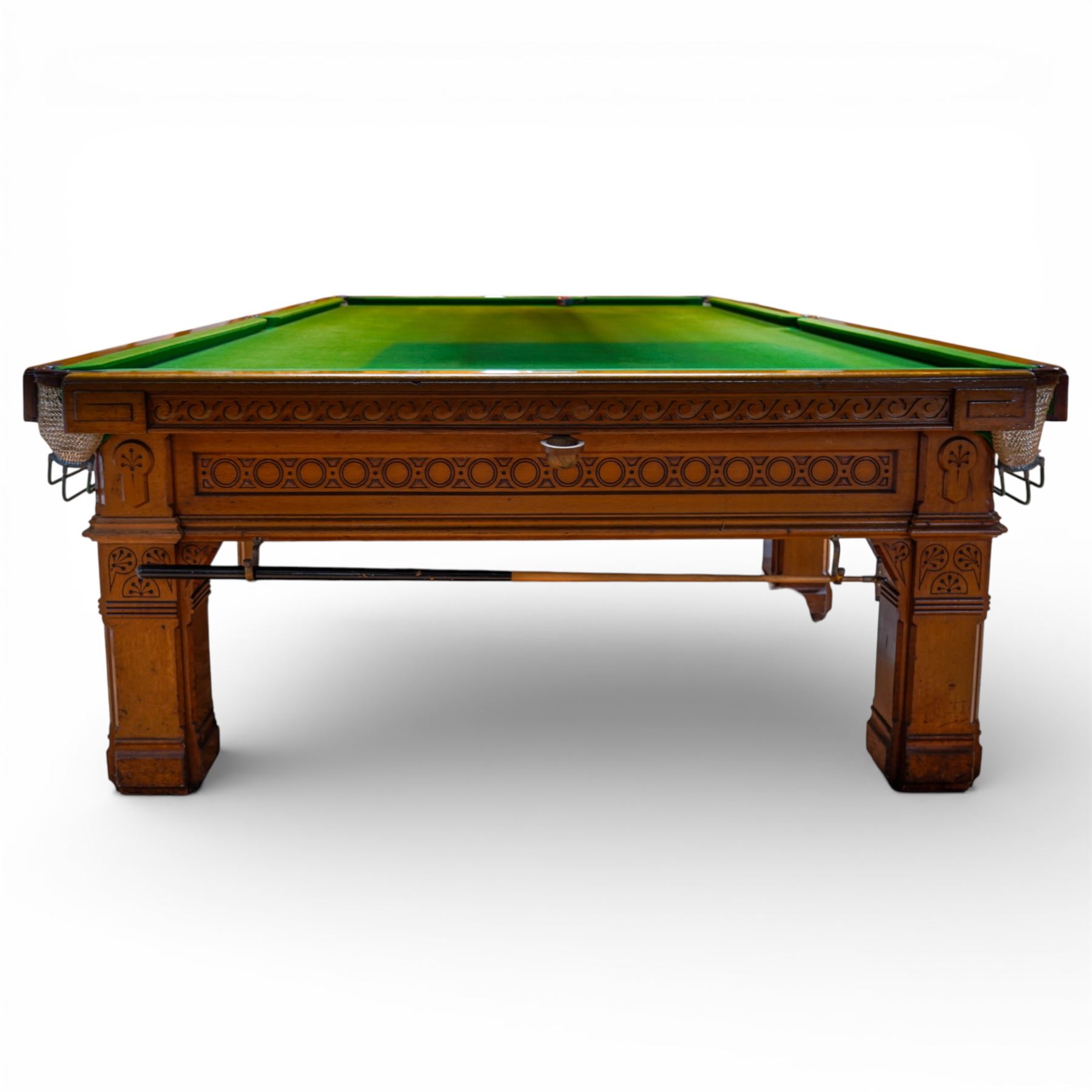 An outstanding bespoke late Victorian Aesthetic Movement golden oak full-sized snooker table of gothic influence, the rectangular slate bed covered in green baize within moulded rails and rounded pocket mounts, the protruding frame decorated with blind-fretwork frieze panels of Vitruvian scrolls and geometric ornament, over rails of repeating roundel carvings, raised on square chamfered and reeded supports with carved detail and panelled reserves, with further stylised brackets, stamped to the underside on all four edges R Anderson, serial number 4337
Viewing in situ near Tadcaster, please contact Chloe to arrange - 01904 393300
