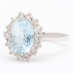 18ct white gold aquamarine and diamond cluster ring, single oval cut aquamarine of approx 1.95 carat, surrounded by fourteen round brilliant cut diamonds, London 2022, total diamond weight approx 0.50 carat