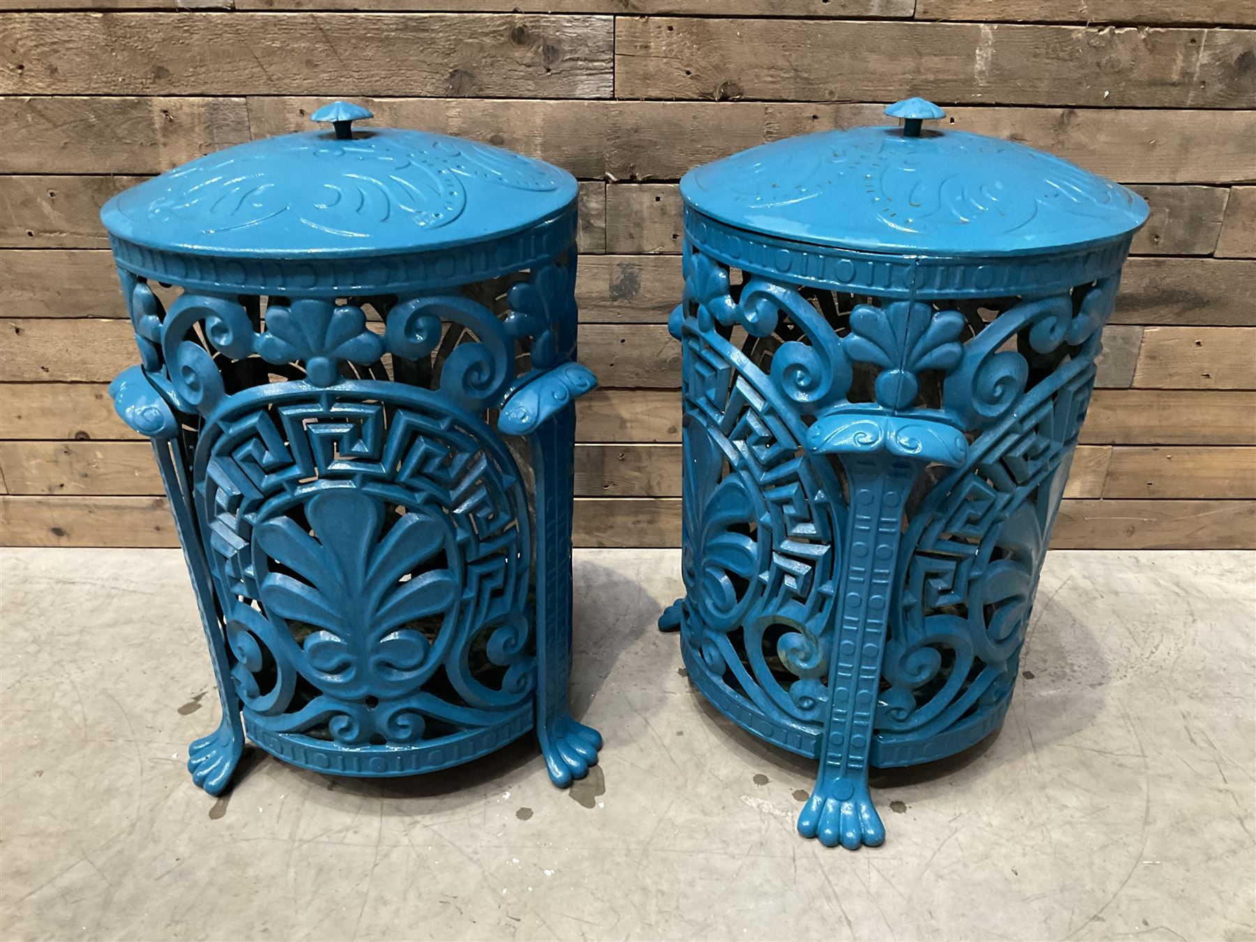 Pair of blue painted cast iron garden bins