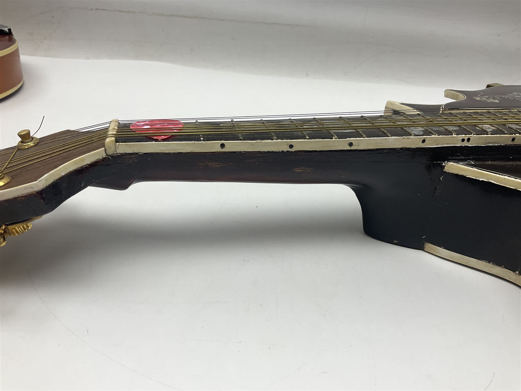 Eastern eight-string mandolin with sunburst finish and mother-of-pearl inlay L68.5cm; and another Harmony mandolin with cracked headstock (2)