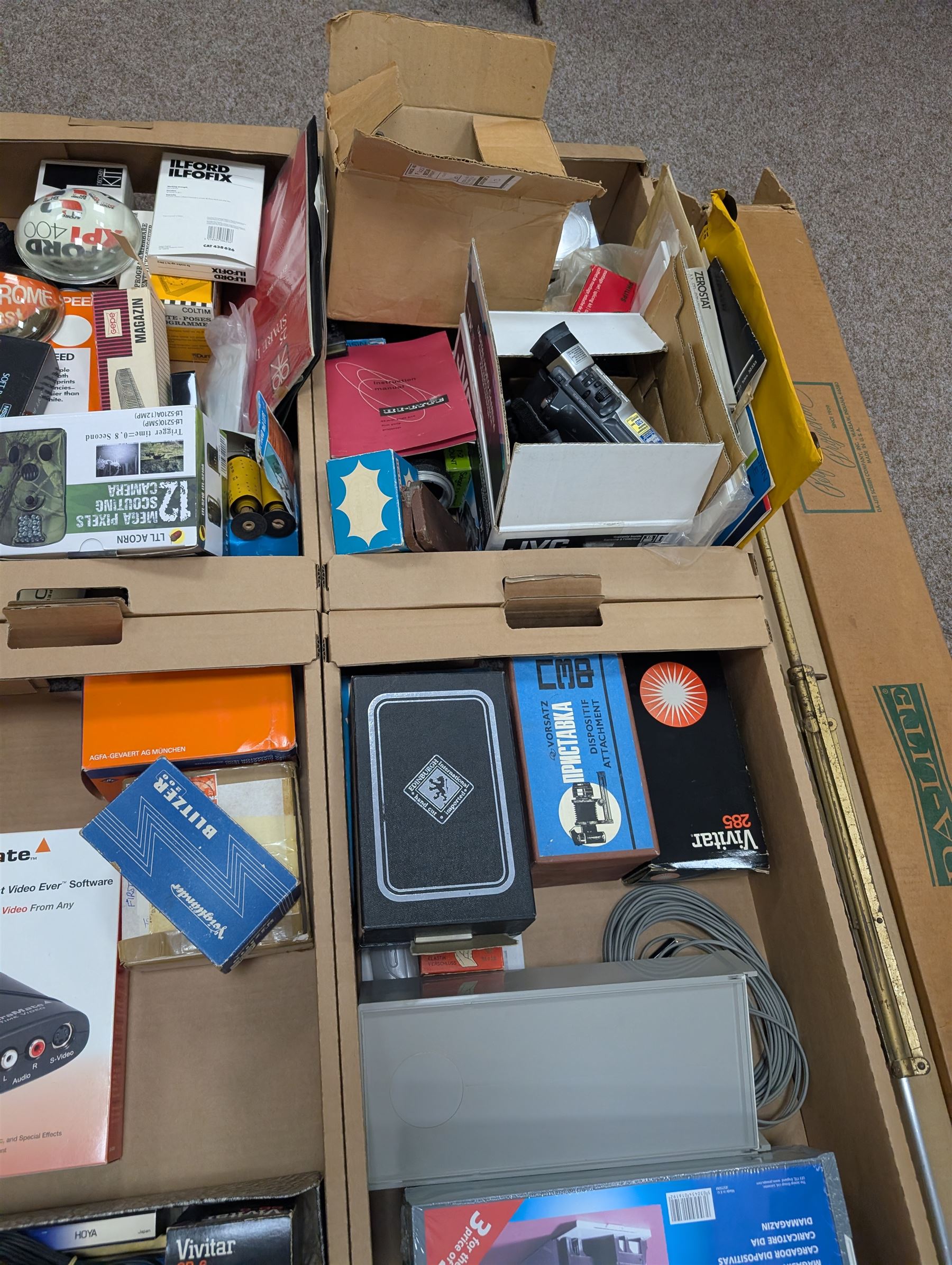 Large collection of photography equipment, including two video cameras JVC and a Panasonic 3CCD, tripods, filters, photograph paper, developing equipment, Dalite projector screen, etc, some boxed some empty boxes, and a Midgard Pocket Microscope