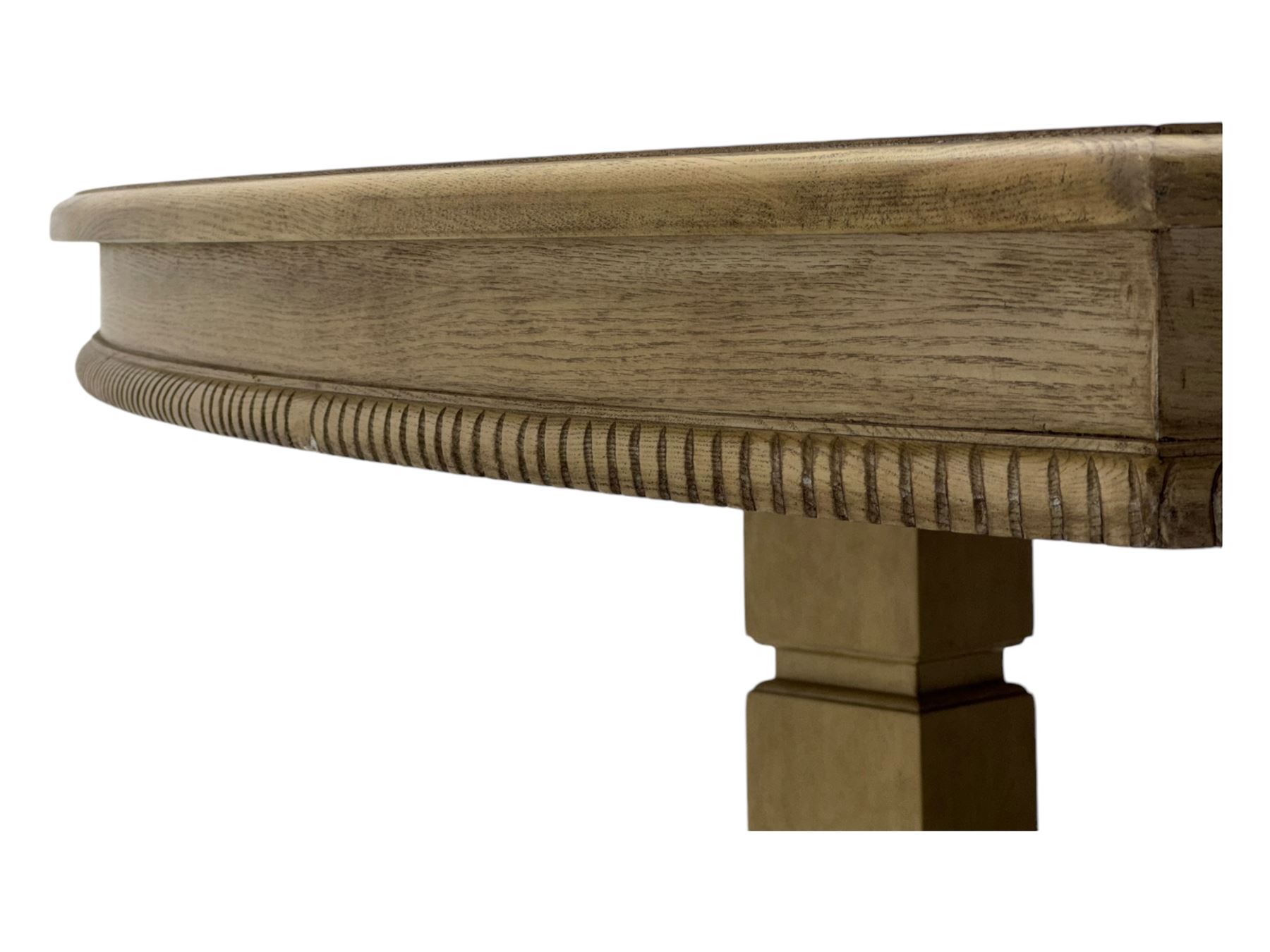 Brunswick - washed oak finish extending dining table, rectangular top with curved ends and carved frieze, central extension leaf, raised on twin pedestals with arched plinth bases and square-sectioned column supports; set of eight (6+2) high-back dining chairs upholstered in beige velvet fabric