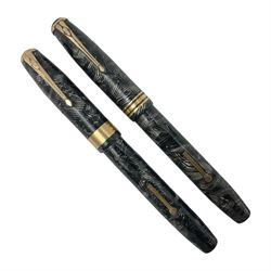 Conway Stewart Executive 60 fountain pen, the barrel and cap with hatched grey and black marble decoration and gold nib stamped Duro 14ct, together with a Conway Stewart 58 fountain pen similarly decorated in pearl blue and black with gold nib stamped 14ct, largest 13cm (2)