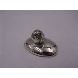 Edwardian silver finial, modelled as a hatching chick, mounted upon a filled silver oval base, both hallmarked Sampson Mordan & Co, Chester 1908, H3.5cm, W6.5cm