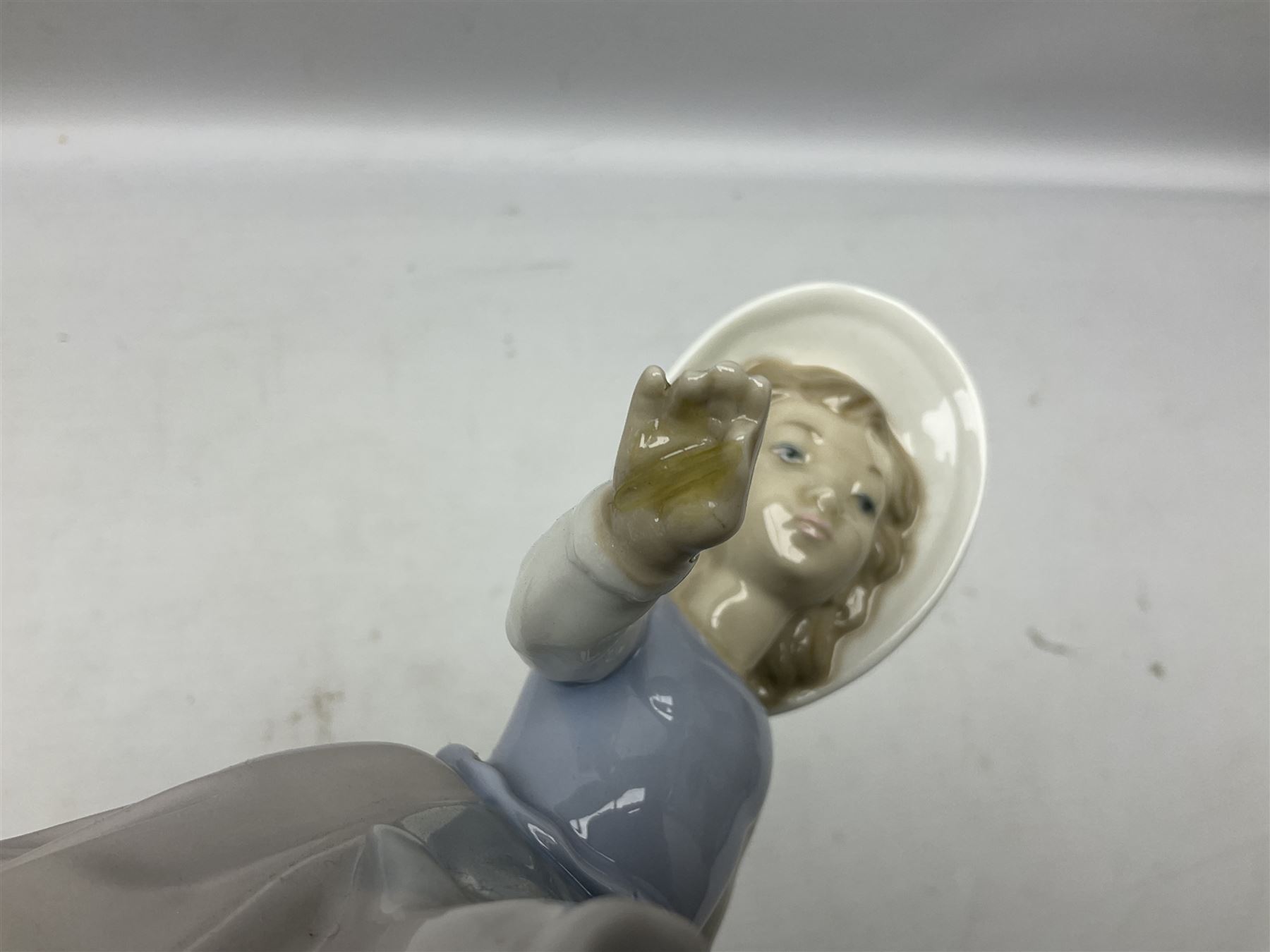 Three Nao figures comprising The Next Dance 1201 and Girls First Communion 0236, and young girl wearing a hat, together with two further Spanish style figures