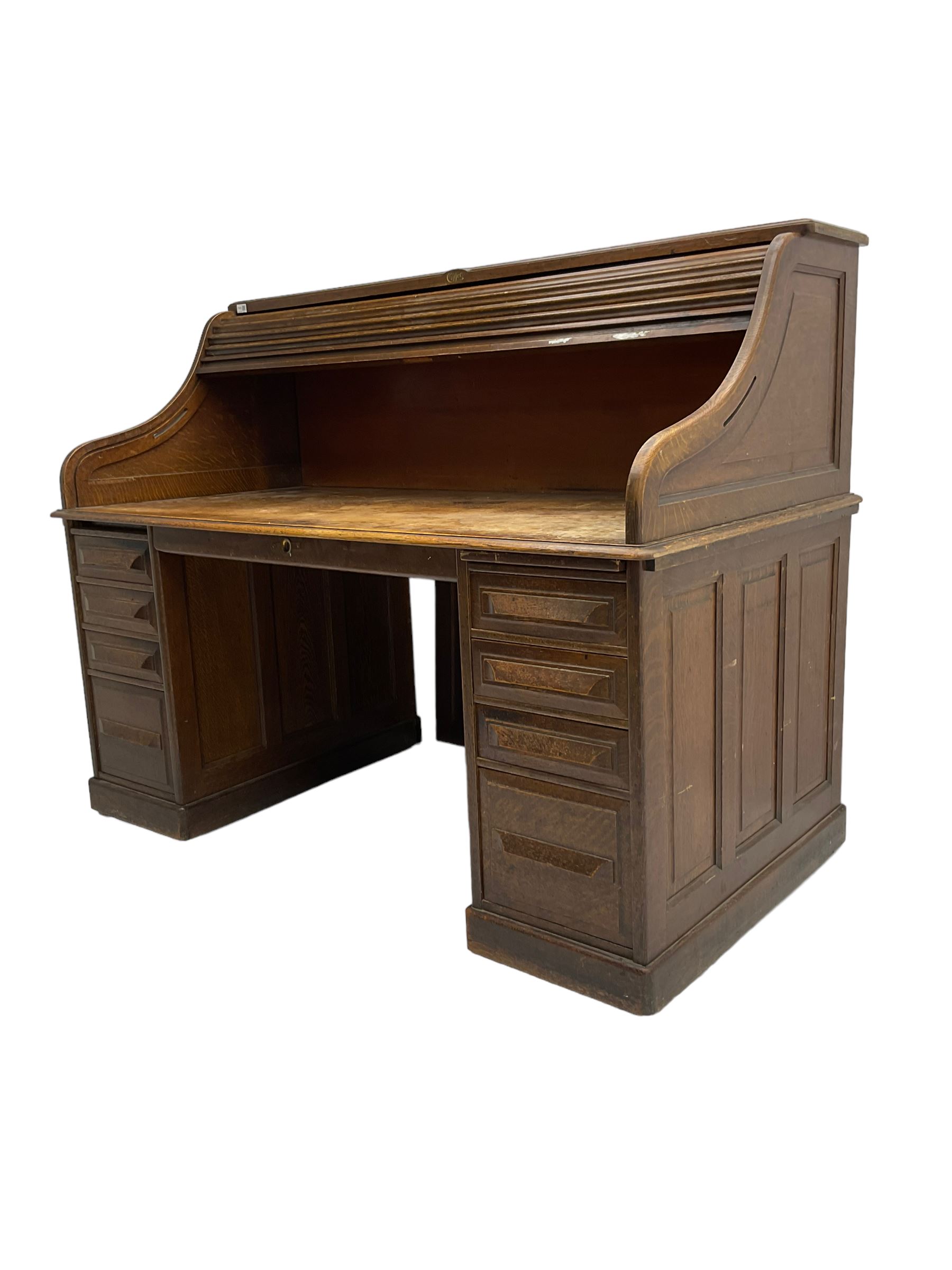 Cutler - early 20th century American oak tambour roll-top desk, the twin pedestals fitted with four graduating drawers
