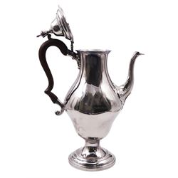 George III silver coffee pot, of bellied form with scroll detail to spout, urn finial to the hinged cover and wooden scroll handle, upon a stepped circular foot, hallmarked Hester Bateman, London 1788, H31.5cm, approximate gross weight 27.97 ozt (870 grams)