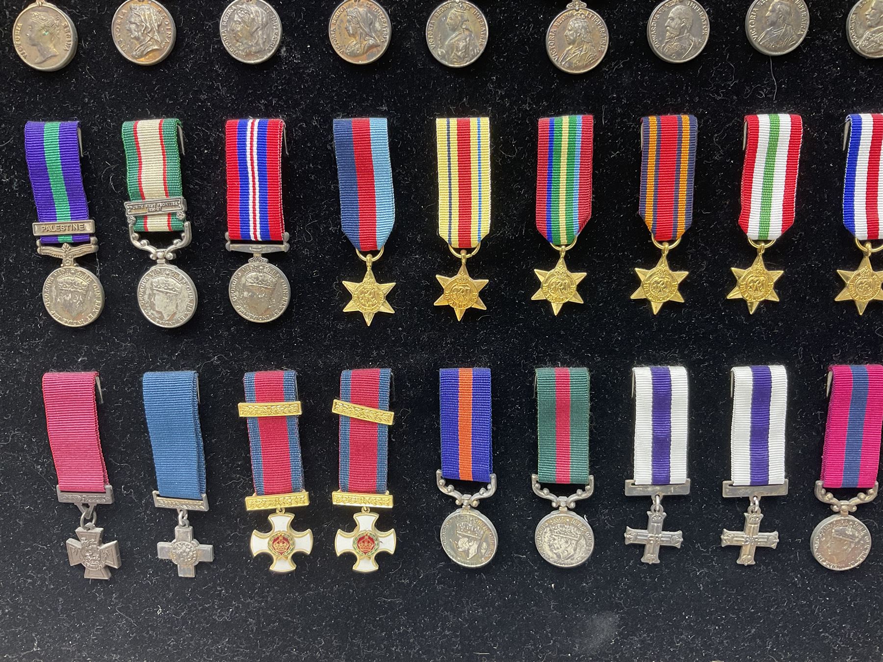 Two limited edition large framed display boards with half-size copies of British Gallantry and Campaign Medals produced by Danbury Mint and entitled 'For Valour'. Sixty medals on each board, all with ribbons. Complete with Danbury Mint certificate serial number A0148 and other paperwork.