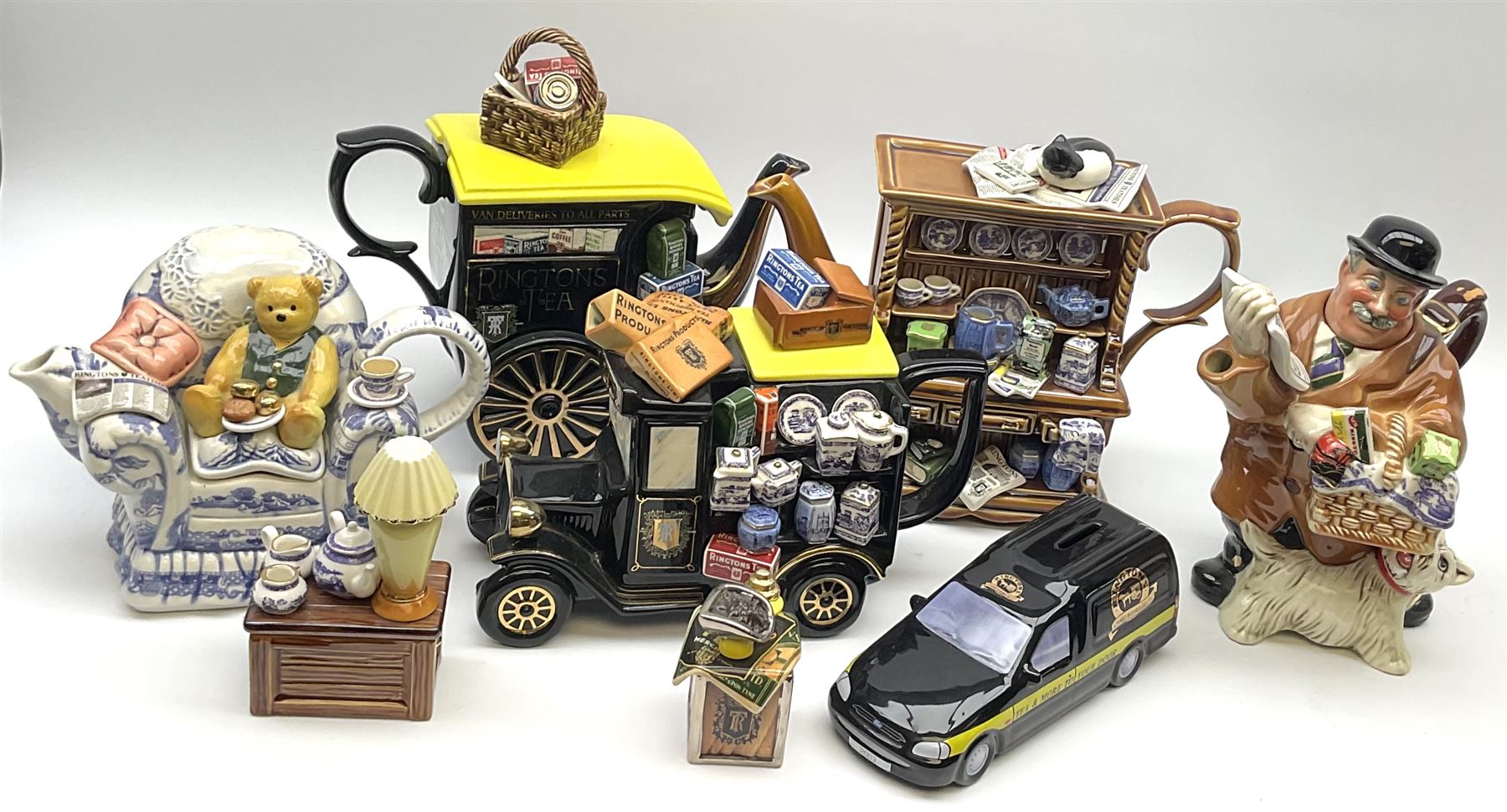 A group of Ringtons novelty teapots, comprising The Ringtons Van teapot, Maurice Delivery Man teapot, Millenium Celebration teapot, the Tea Merchant teapot, and Tea Time teapot, each with certificate, together with a Ringtons novelty money box.  