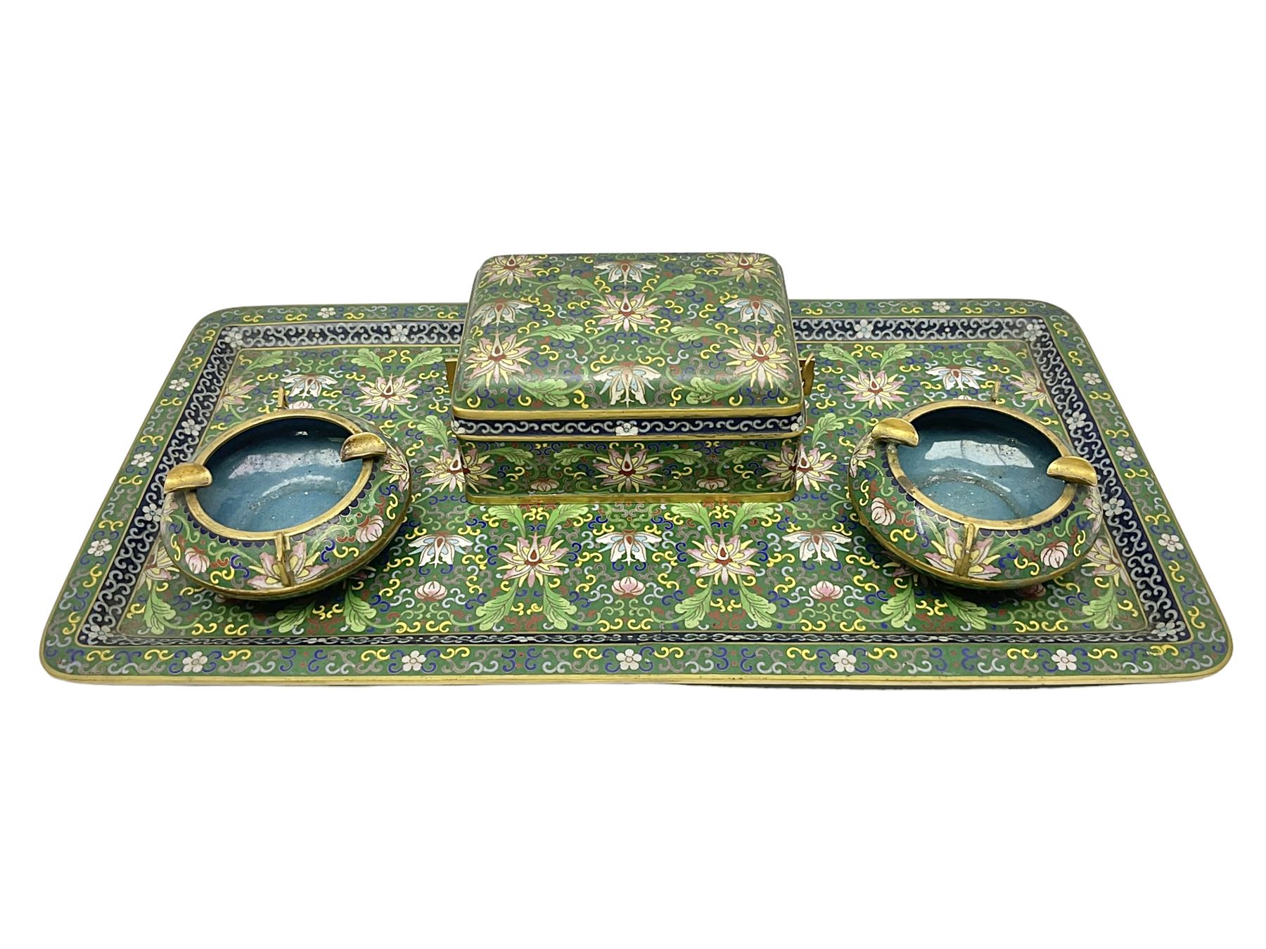 20th century Chinese cloisonne enamel smoking set, comprising two ashtrays, box and tray, with floral and foliate scrolling on green ground