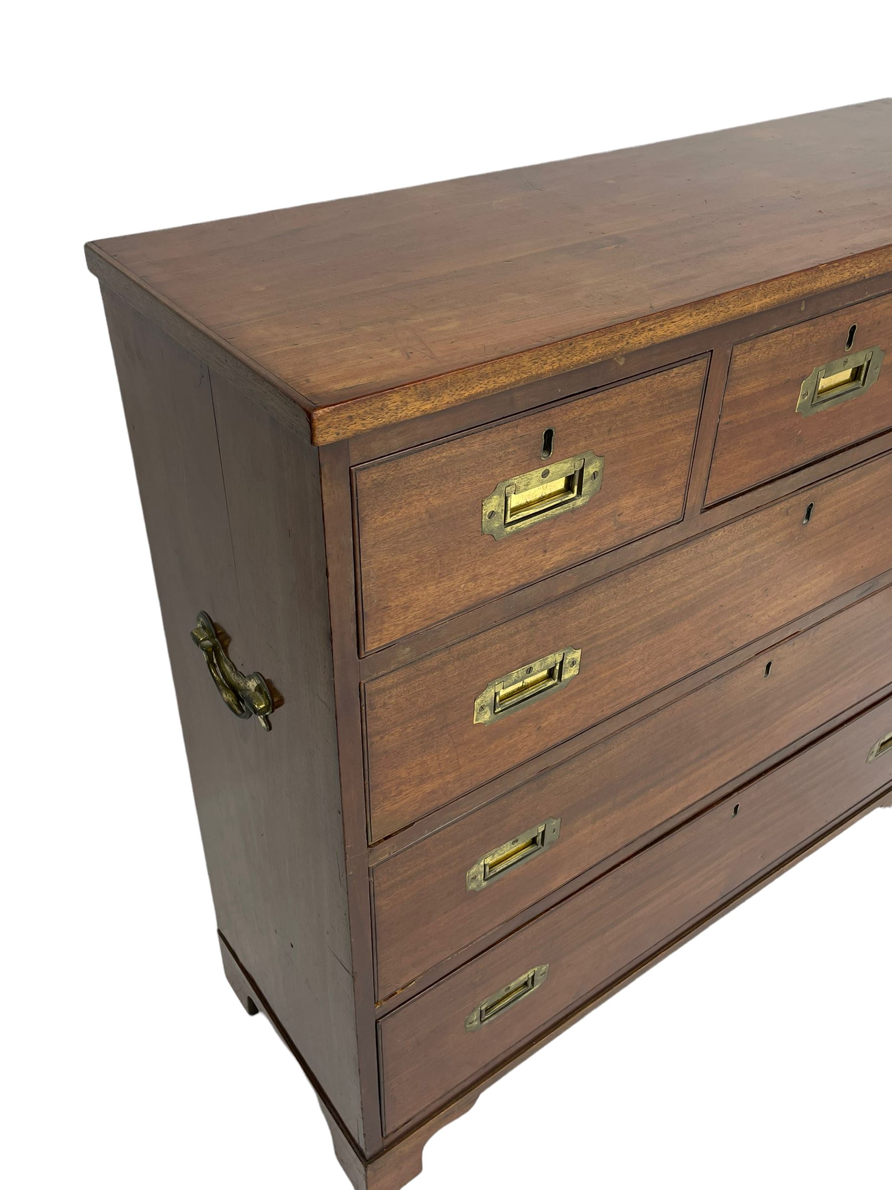 Georgian military type campaign chest, narrow rectangular top over three short and three long drawers, recessed brass handles, on bracket feet
