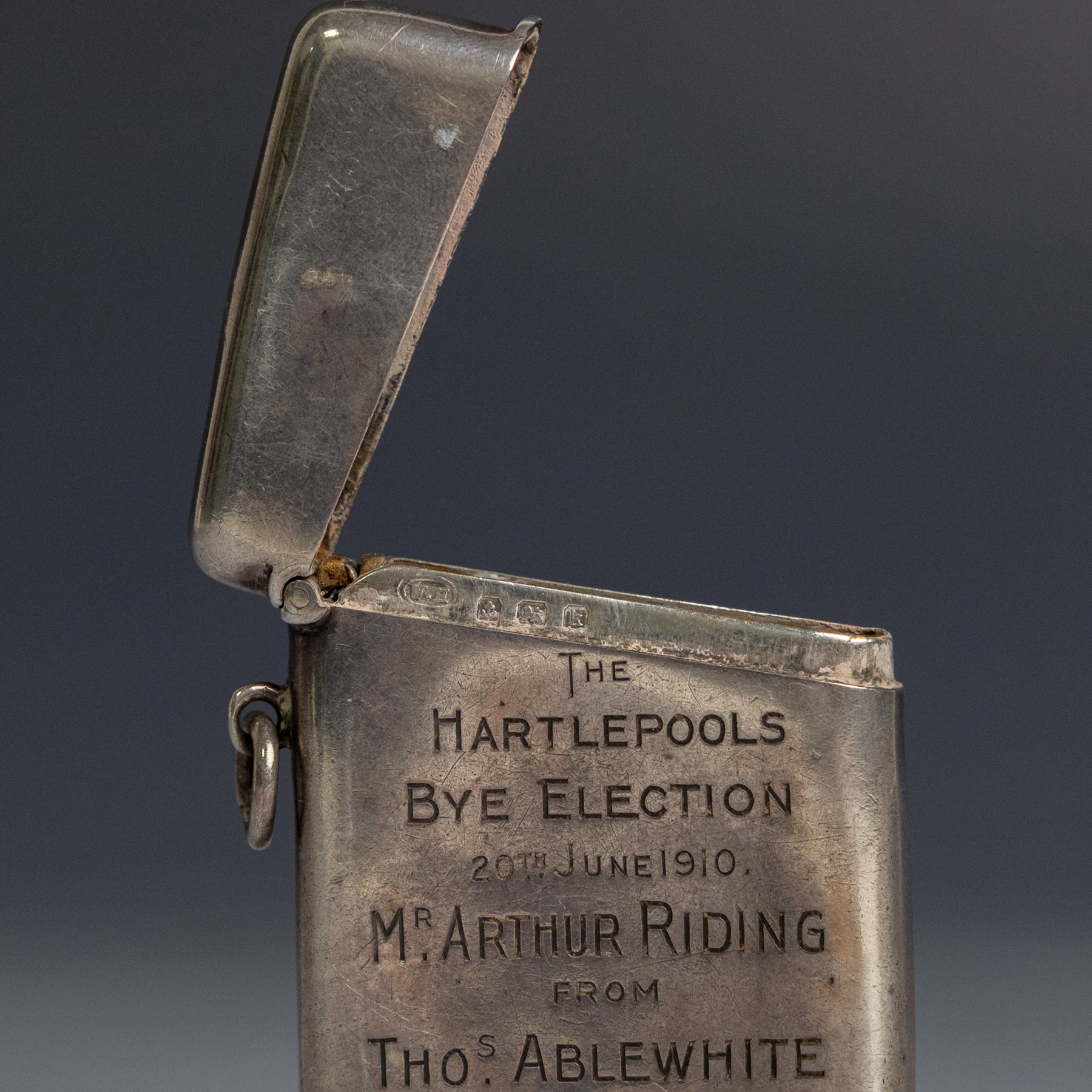 Edwardian silver vesta case, with presentation engraving reading 'The Hartlepools Bye Election 20th June 1910 Mr Arthur Riding from Tho.s Alblewhite Pleasant Memories', hallmarked 	William M Hayes, Birmingham 1909
