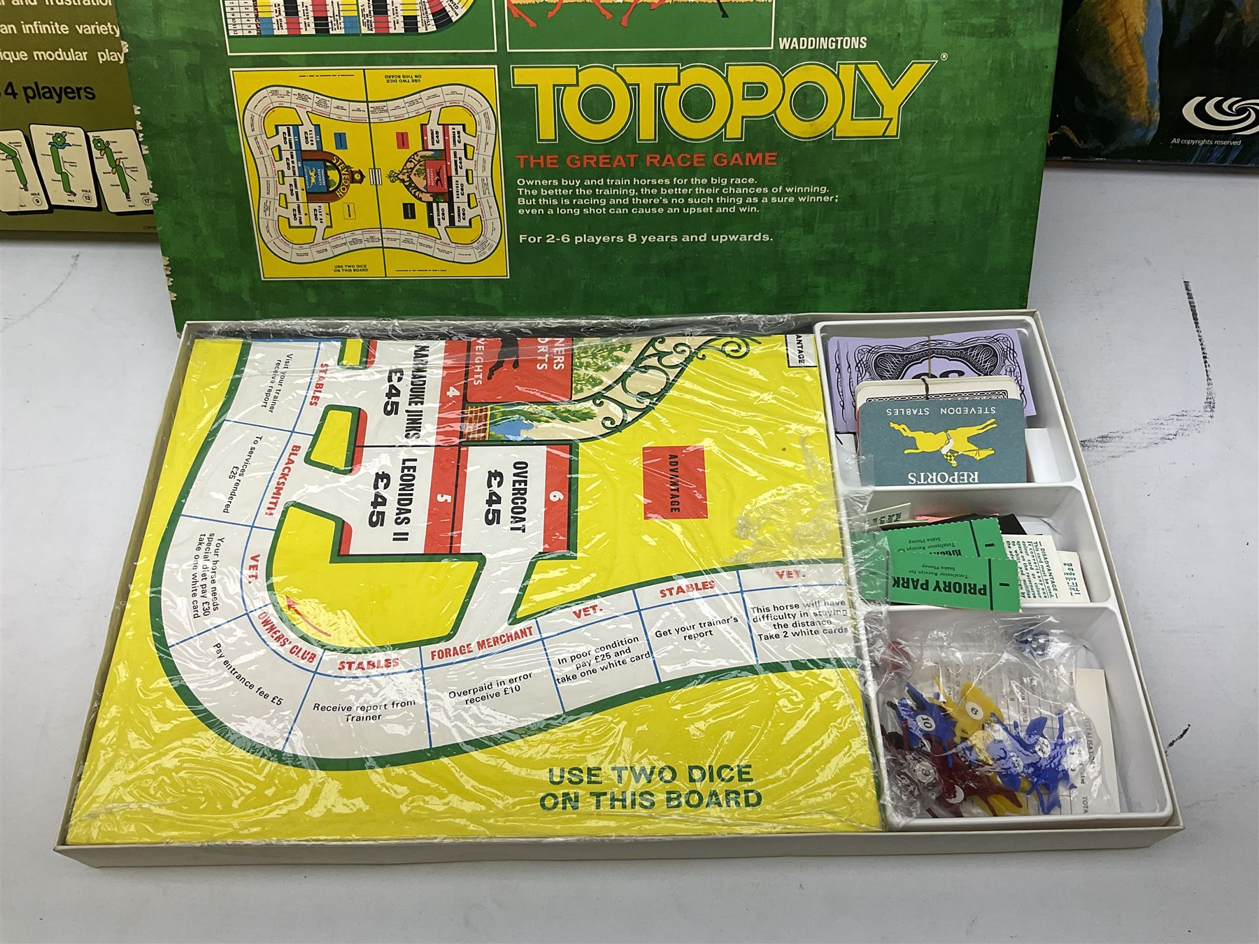 Meccano - Set No.5 with instruction booklets and Set 1+1X Conversion Set; both boxed; Adman Grandstand TV Game; boxed; Parker Colditz Board Game; and four Waddingtons Board Games including Cube Fusion, Totopoly, Golf Winks and Buccaneer; all boxed (8)