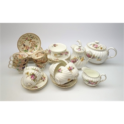 A Foley teaset, comprising tea pot, hot water jug, six teacups and six saucers, six side plates, milk jug, and open sucrier, each decorated with floral sprays, together with Victorian chinoiserie decorated tea wares, comprising six teacups with flying ring handles and six saucers.
